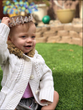 Load image into Gallery viewer, Baby with hand-made tiara outside on grass
